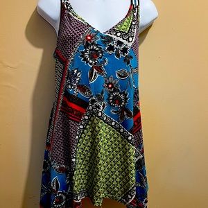 Multicolor print tunic,sleeveless , back design embellished, handkerchief bottom